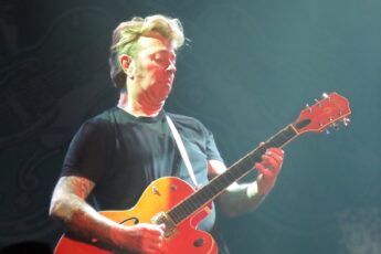 "Like I am wearing a pair of gloves when I try to play." Then Brian Setzer got his hands back