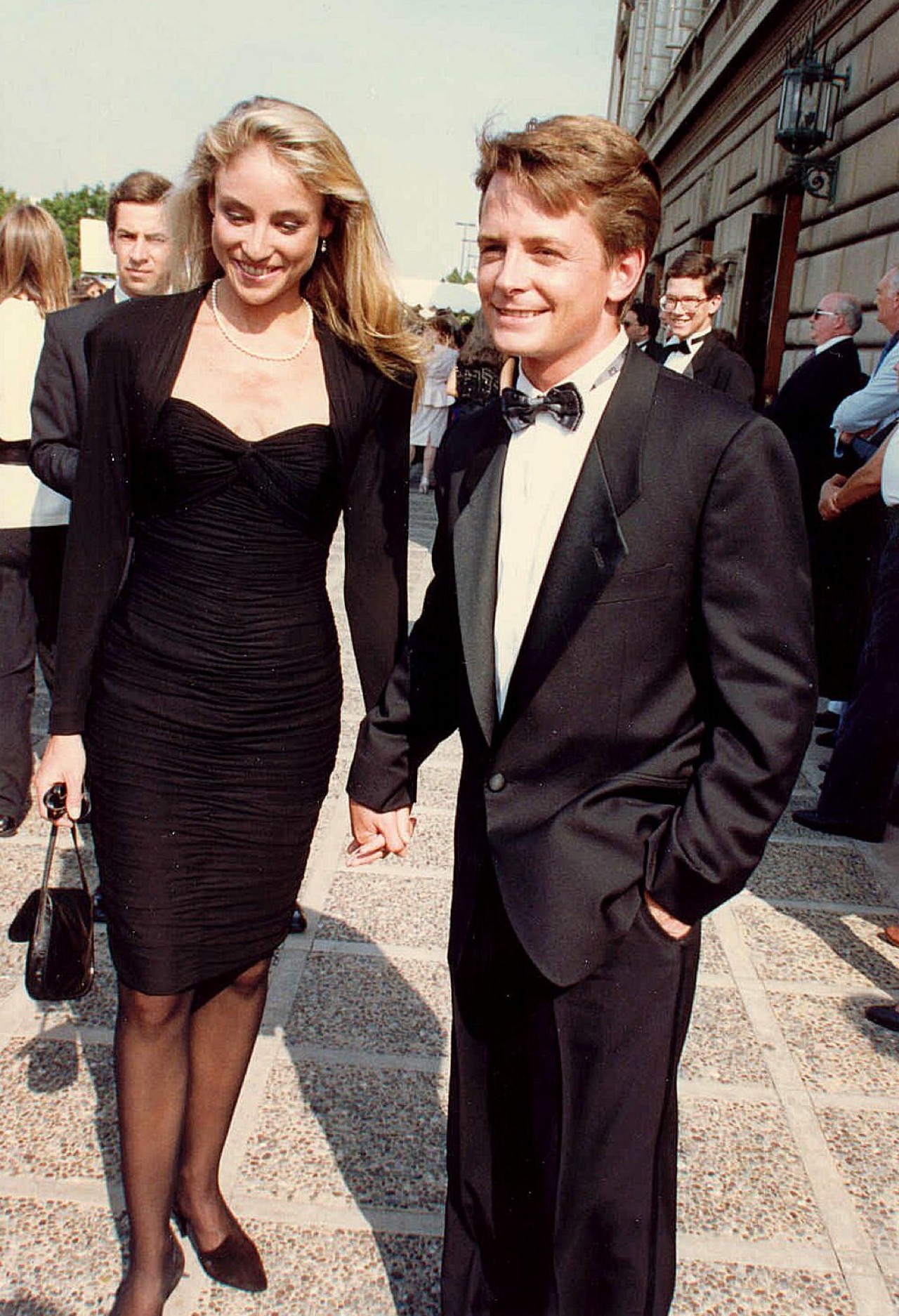 He was 29 and the biggest star in America when the diagnosis came. The woman holding his hand in this photo is still holding it, 38 years later