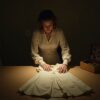 The whole storage unit cost me $150, sight unseen. Inside was a wedding dress from 1964 — and something sewn into the hem that had been waiting thirty years.